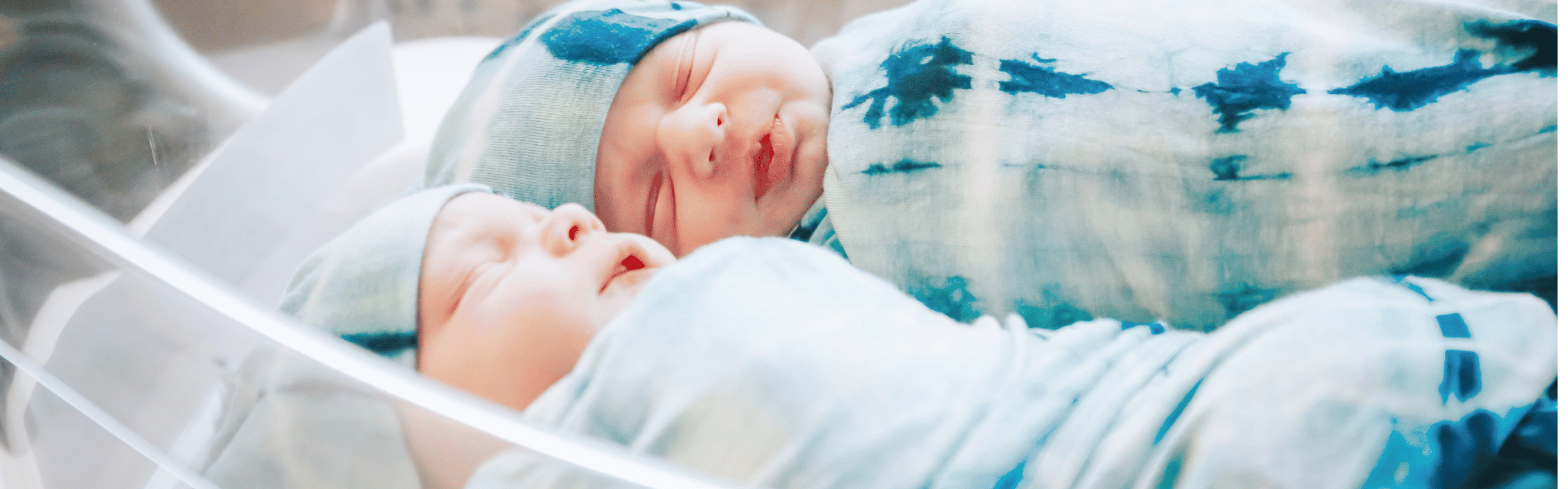 Twins-in-bassinet-1900x900-min-1